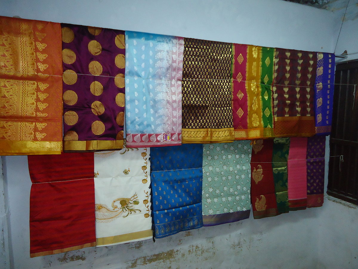 Kanchipuram sarees, South Indian textiles, silk weaving, zari work, traditional patterns, artisanal craftsmanship, Tamil Nadu, Indian wedding attire, ceremonial wear, textile art history.