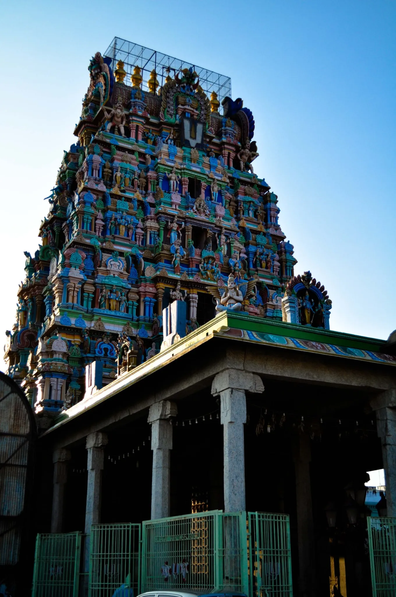 Sri Ramanujar Temple, gopuram, Hindu temple, colorful architecture, Dravidian style, South Indian temple, intricate carvings, temple entrance, sacred art, mythological figures, Sri Ramanuja, Vaishnavism, spiritual site, religious architecture