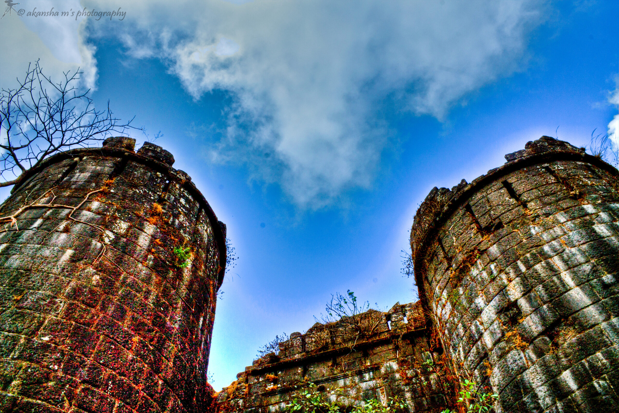 Sinhagad fort, ancient ruins, historical architecture, stone towers, HDR photography, cultural heritage, Indian forts, vibrant colors, ancient structures